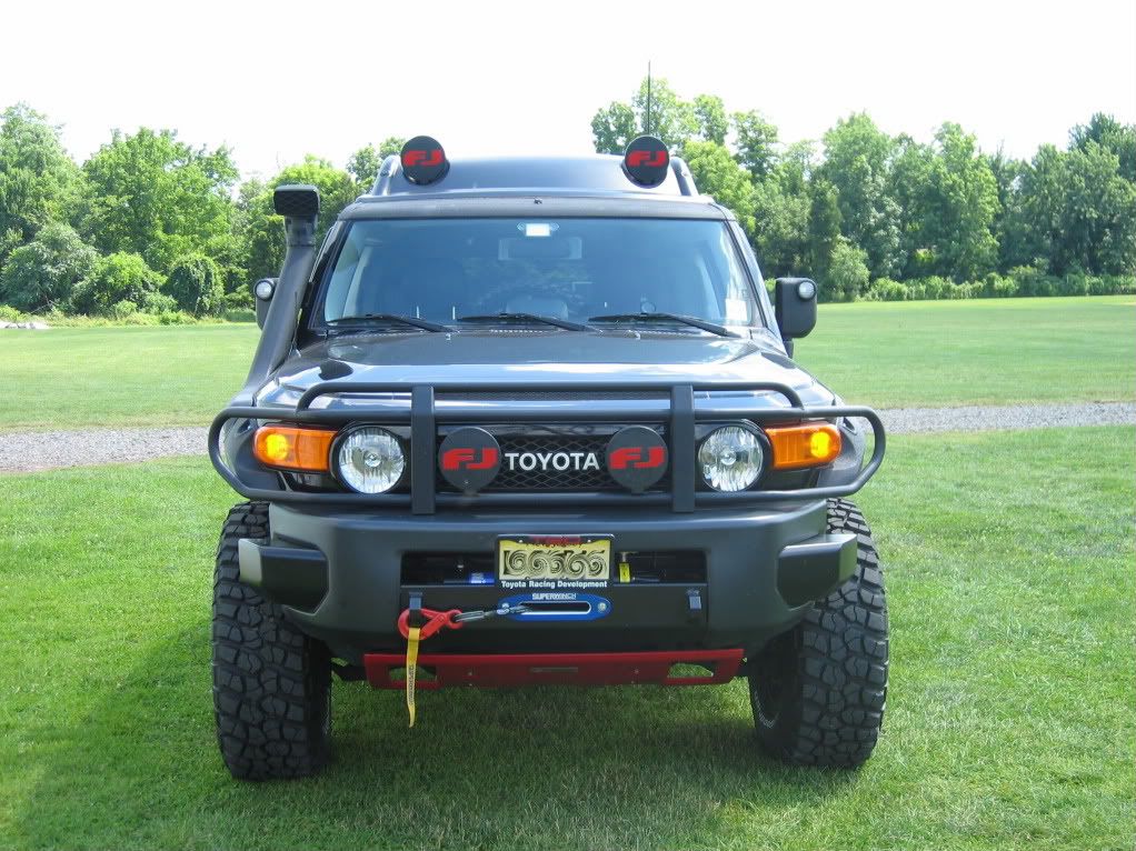 Bushwacker fender flares packet style and OEM brush guard Toyota FJ